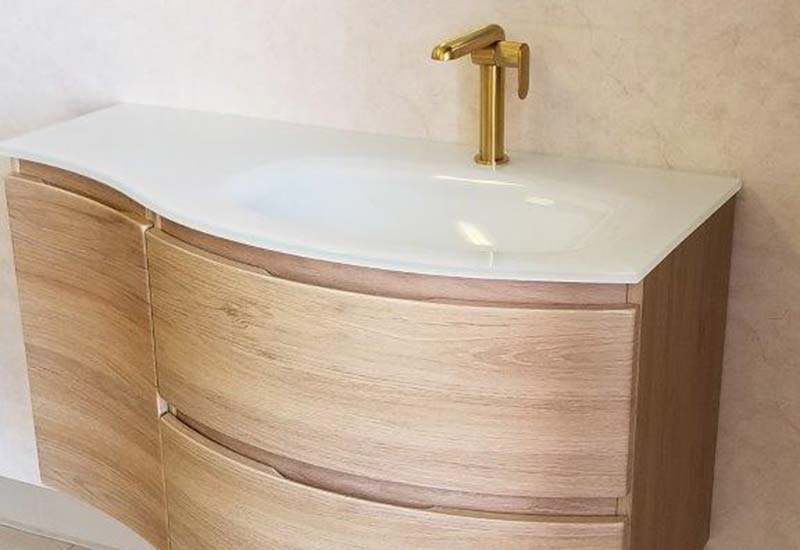 Modern bathroom sink with gold fixtures