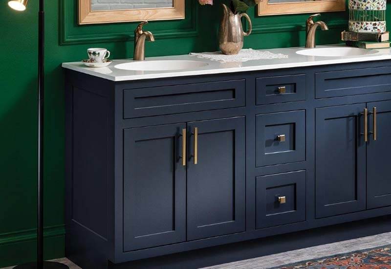 Blue bathroom cabinets with white counter top