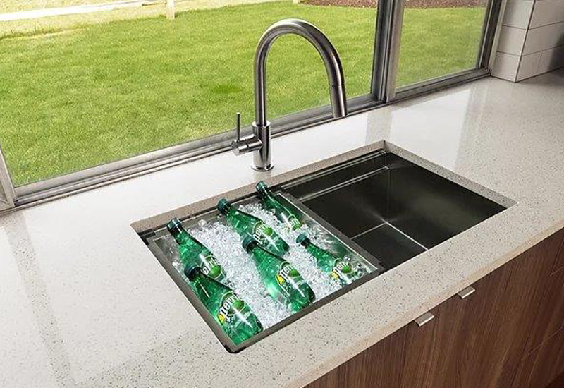Kitchen sink with drinks on ice in the left side